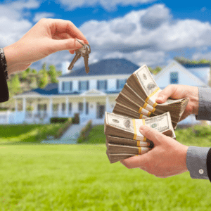 Homeowner shaking hands with buyer in front of house