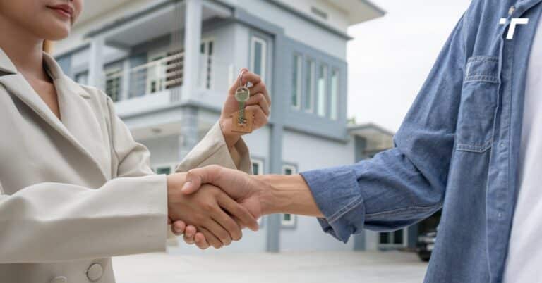 Homeowner shaking hands with a local cash buyer after a successful home sale in Utah