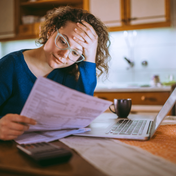 Utah homeowner reviewing a cash offer while considering selling their home