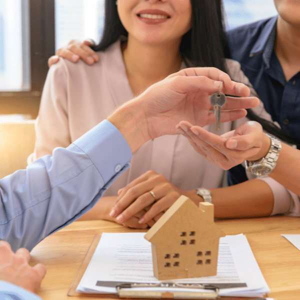 True American Homes consultant reviewing home sale documents with a Utah seller