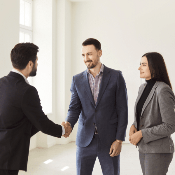 Local Utah real estate team reviewing cash offer with homeowner